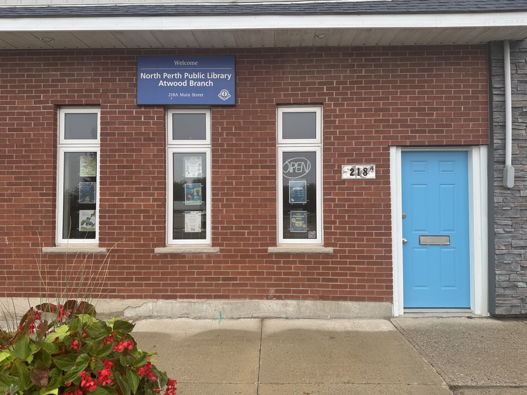 front facade of building with bright blue door